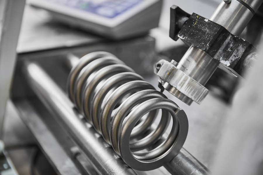 compression spring being manufactured
